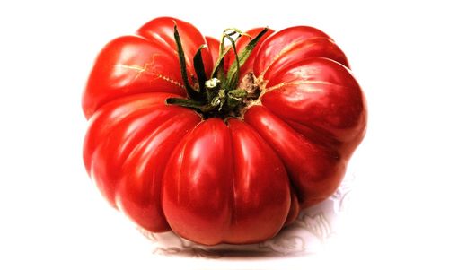 Close-up of strawberry over white background