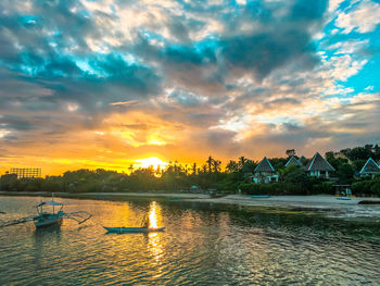 Scenic view of dramatic sky over landscape during sunset