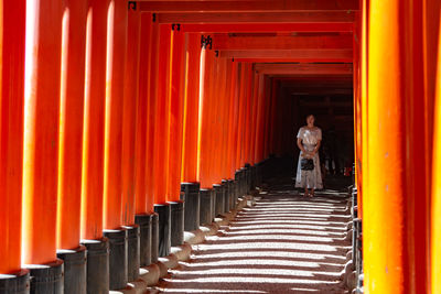 People standing outside temple in building