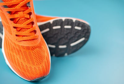 High angle view of shoes on table against blue background