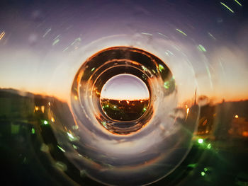 Reflection of illuminated sky on glass