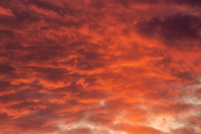 Low angle view of orange cloudy sky