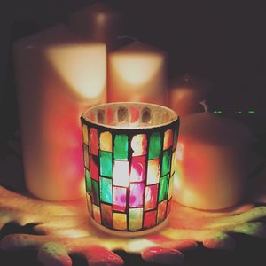 Close-up of illuminated lantern on table