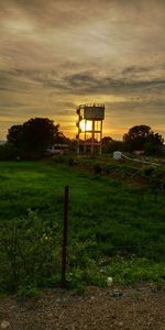 Scenic view of field against sky during sunset