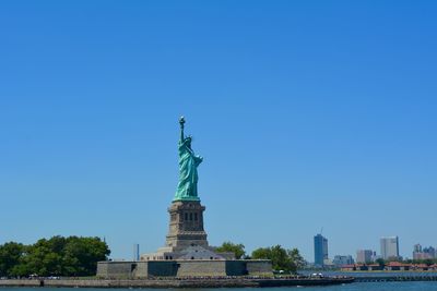Statue of liberty against blue sky