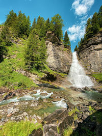 Scenic view of waterfall in forest