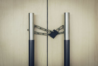 Close-up of locked wooden door 