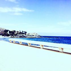 Scenic view of sea against blue sky