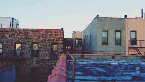 Buildings in city against sky