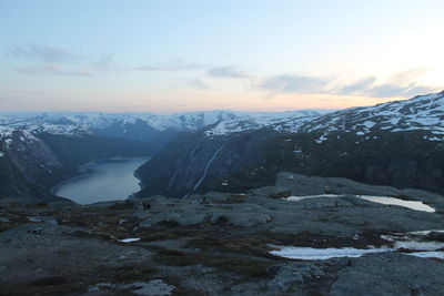 Scenic view of snowcapped mountains against sky during sunset