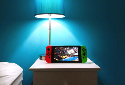 Illuminated lamp post on table at home
