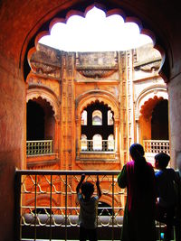 Tourists at entrance of historical building