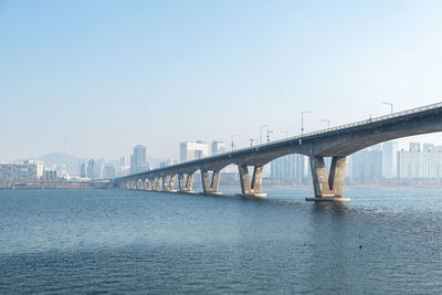 Bridge over river against clear sky