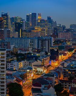 High angle view of illuminated buildings in city at night
