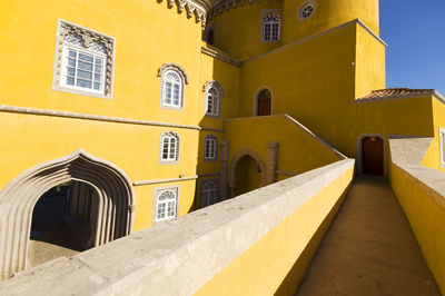 Narrow pathway along built structures