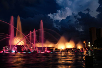 Panoramic view of illuminated city against sky at night