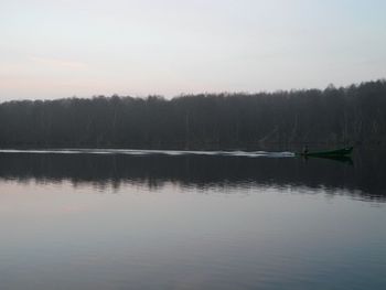 Reflection of trees in calm lake