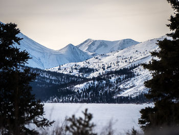 Scenic view of mountains against sky during winter