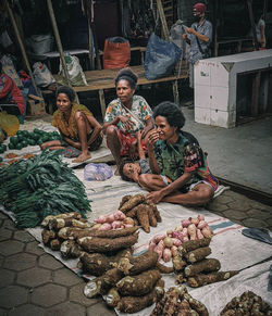 Group of people at market stall