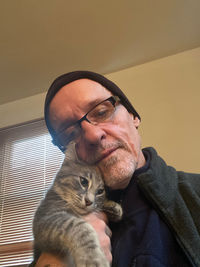 Portrait of young man wearing eyeglasses with his best friend