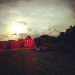 Scenic view of landscape against sky at sunset