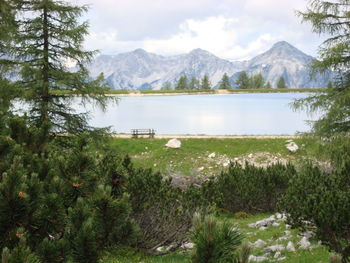 Scenic view of lake and mountains against sky