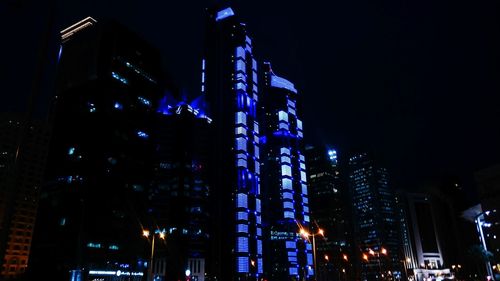 Low angle view of modern building at night