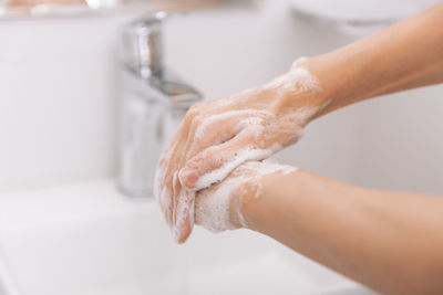 Cropped image of hands with soap sud