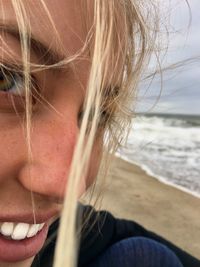 Close-up portrait of woman at beach