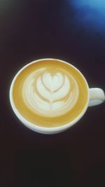 Close-up of cappuccino on table