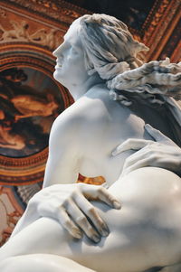 Low angle view of statue against building