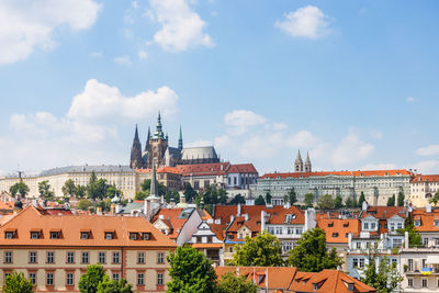 Buildings in city against sky