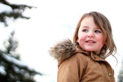 Portrait of a smiling girl in winter