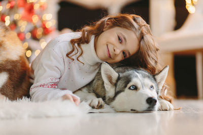 Portrait of young woman with dog