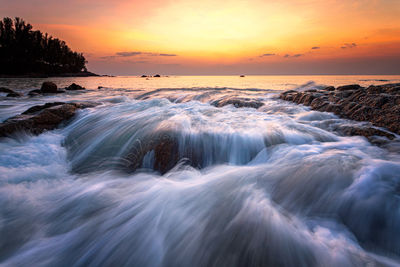 Scenic view of sea against sky during sunset
