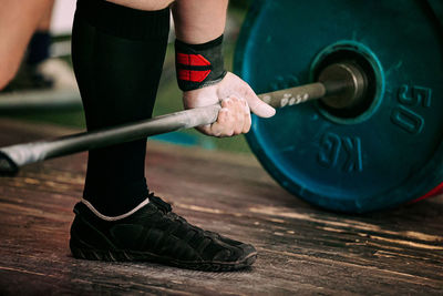 Low section of man exercising in gym