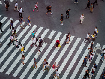High angle view of people crossing road