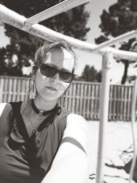 Portrait of young woman wearing sunglasses