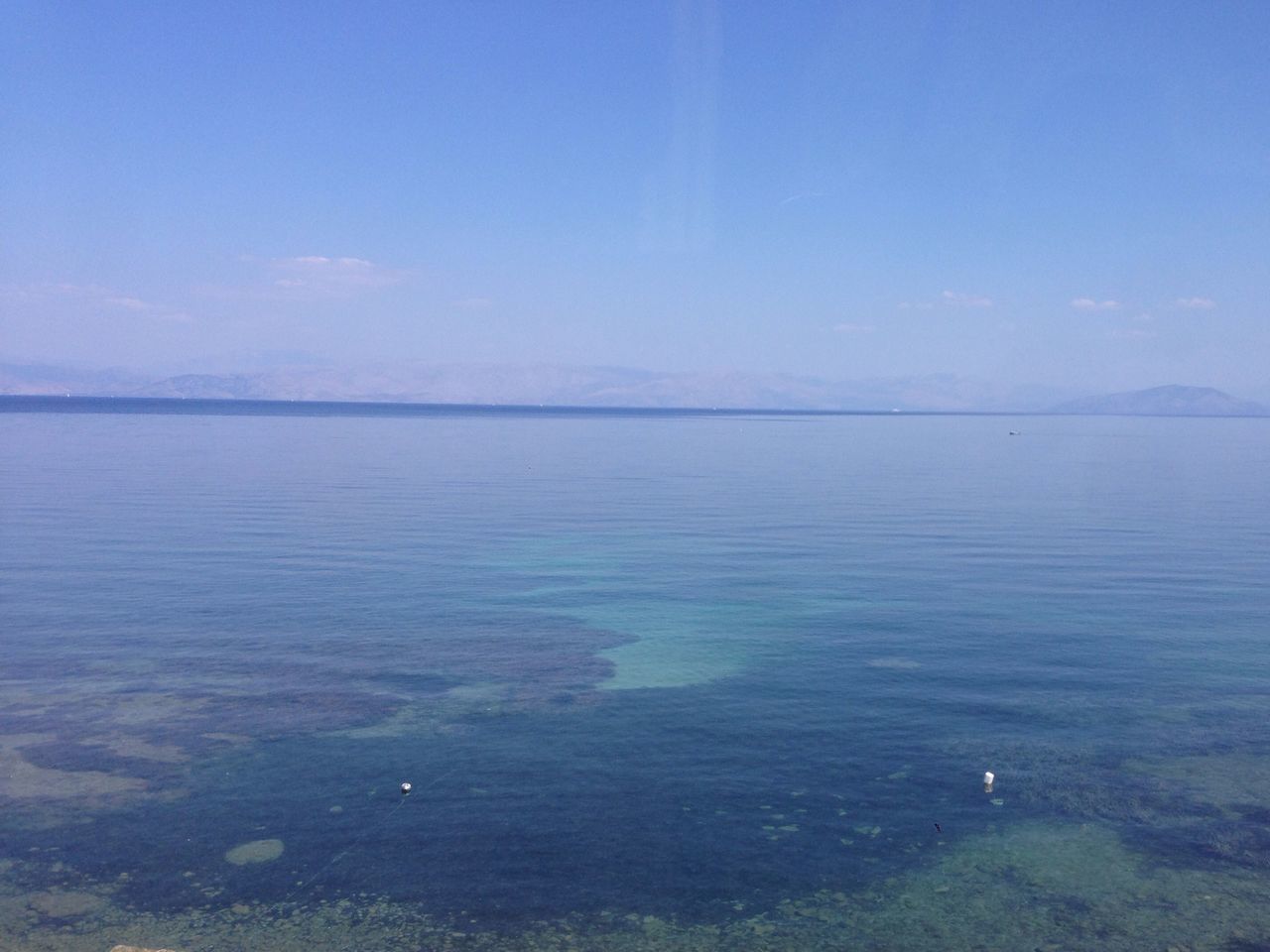 water, tranquil scene, tranquility, scenics, blue, beauty in nature, sea, nature, copy space, sky, waterfront, idyllic, lake, rippled, calm, clear sky, reflection, remote, non-urban scene, outdoors