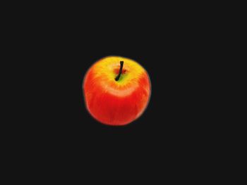 Close-up of apple against black background