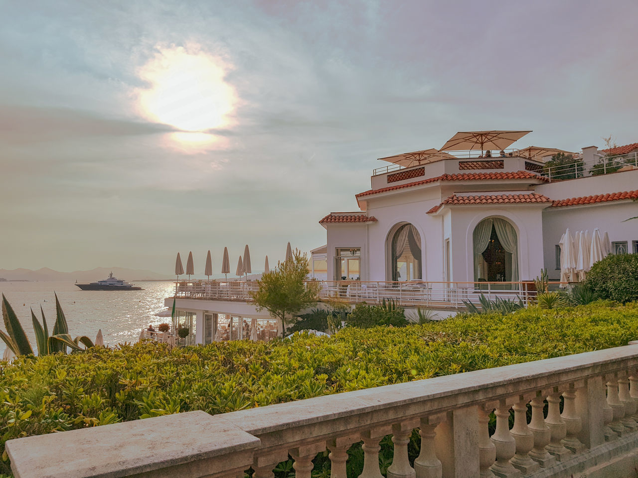 sky, architecture, built structure, cloud - sky, building exterior, nature, plant, sunset, water, no people, arch, history, travel destinations, the past, tourism, beauty in nature, building, travel, outdoors