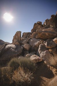 Rocks on mountain against clear sky