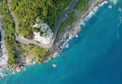 Aerial view of mountain by sea