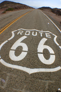 Close-up of road route 66 on street