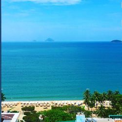 Scenic view of sea against blue sky