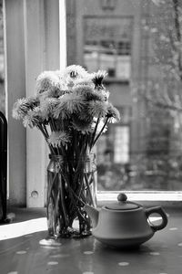 Close-up of flower vase on table