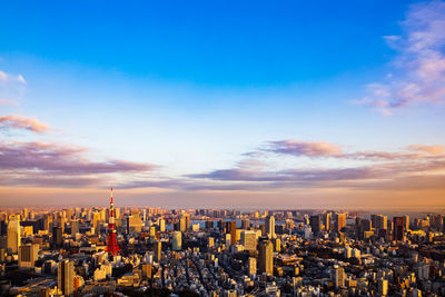 Aerial view of city against sky during sunset