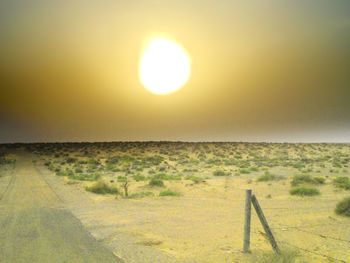 Scenic view of landscape at sunset