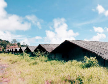 House on field against sky
