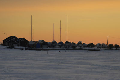 Scenic view of beach against sky during sunset